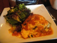 Vegetarian Moussaka -- Casserole of zucchini, eggplant, spinach, sweet peppers, and potato topped with béchamel, served with baby greens